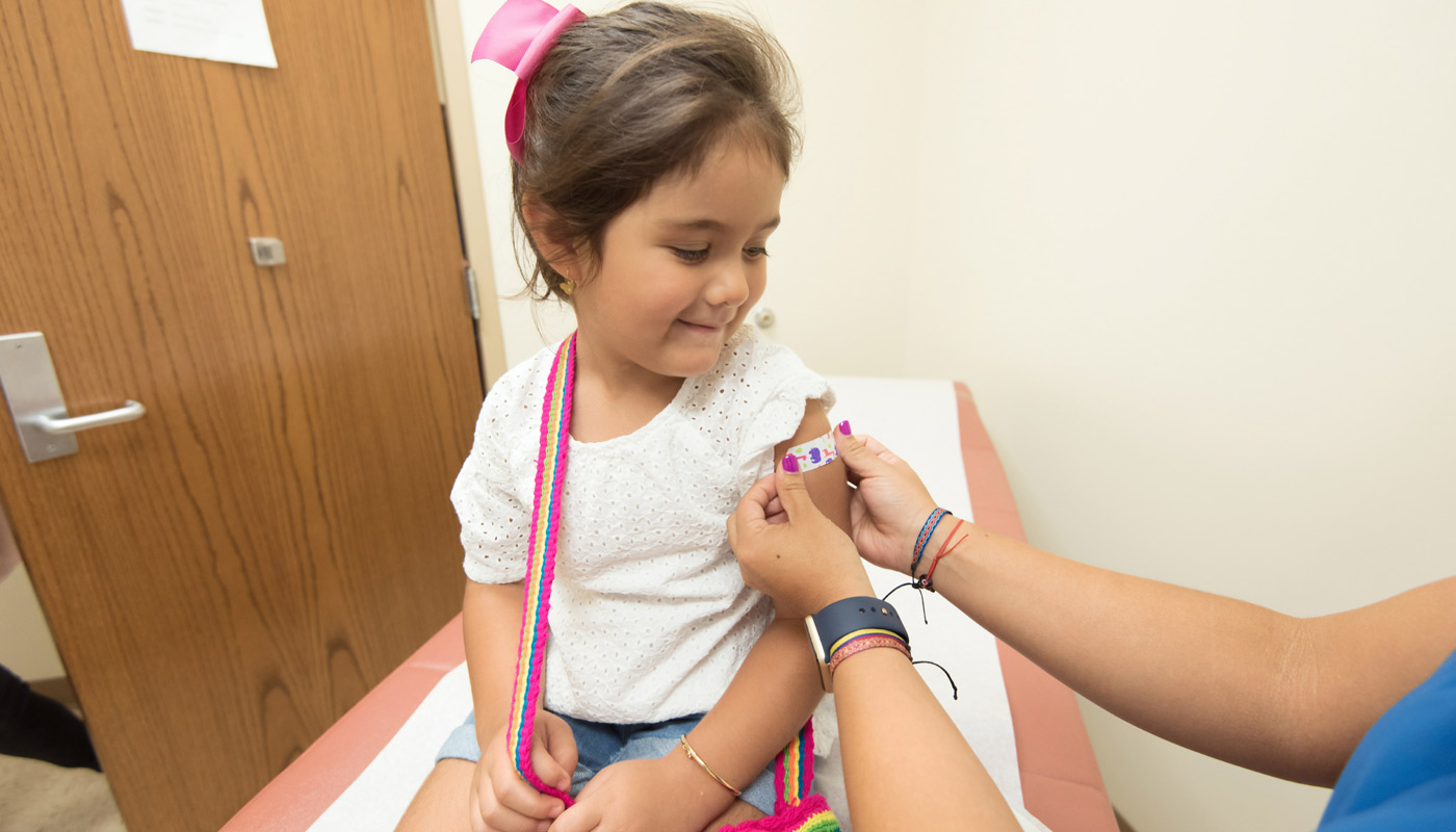 Young girl getting flu shot